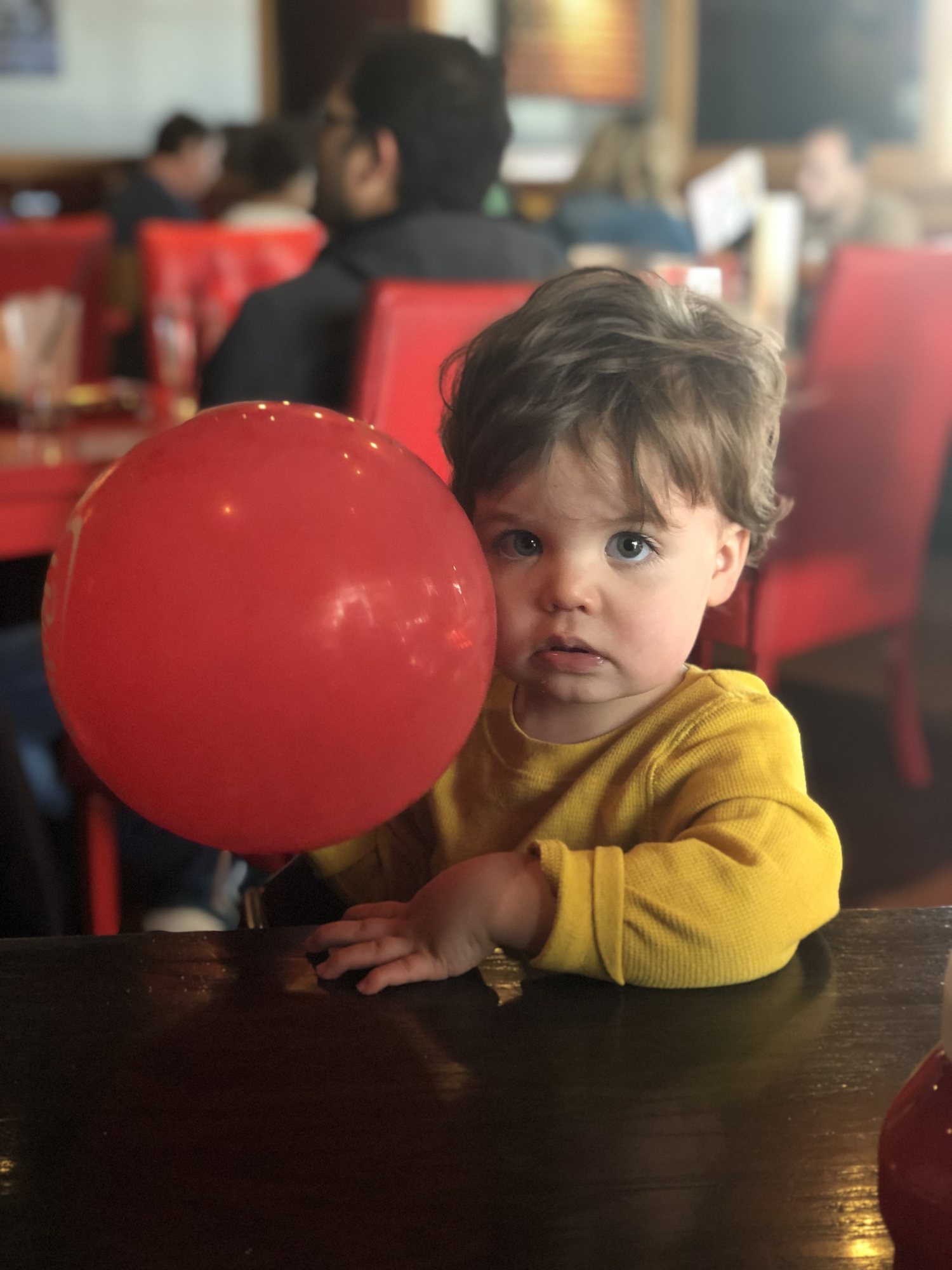Post-snow lunch. Despite appearances, this kid LOVES balloons.