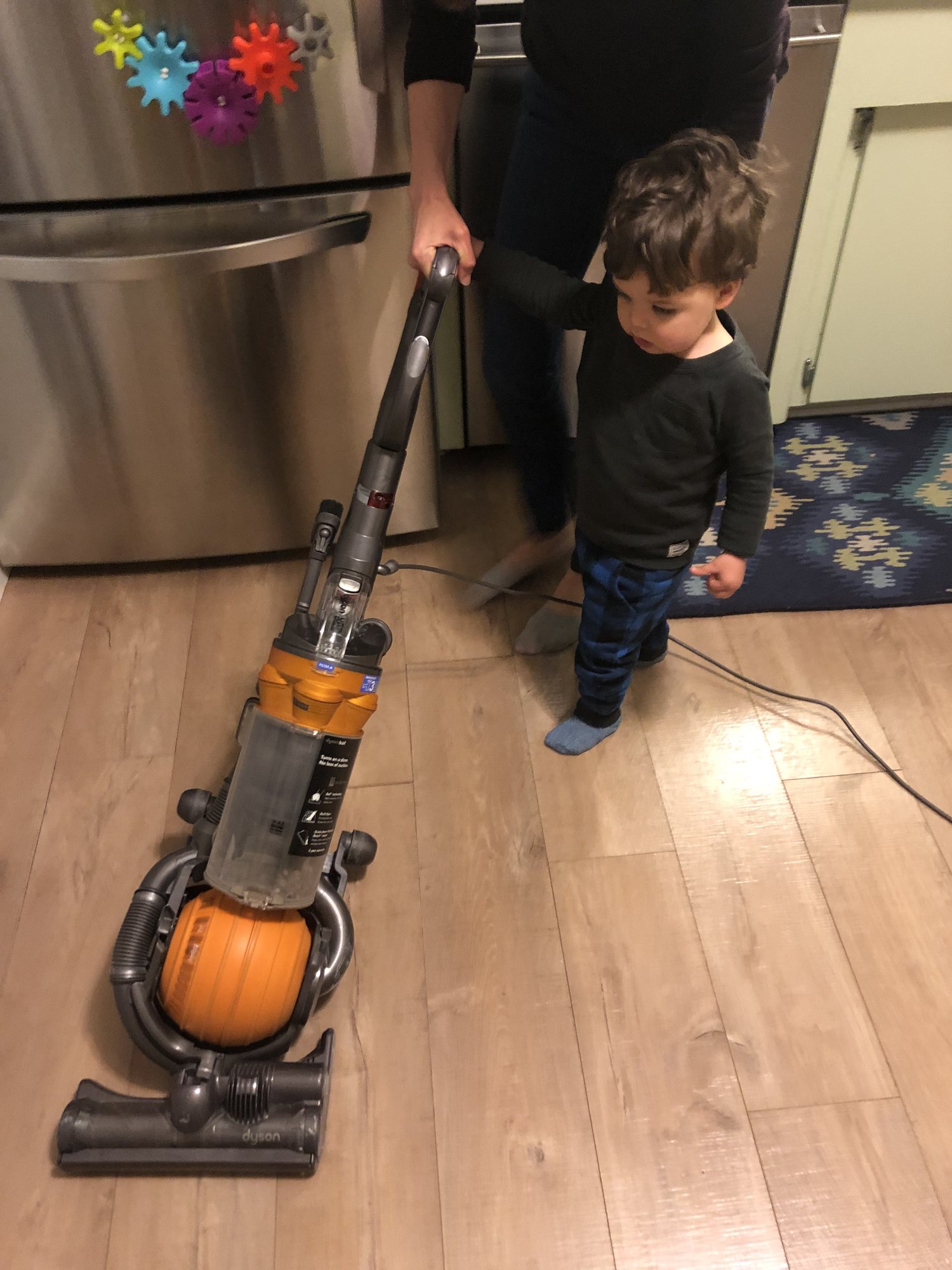 Ben LOVES the vacuum. We should get him a teeny one so he can clean the house for us :)
