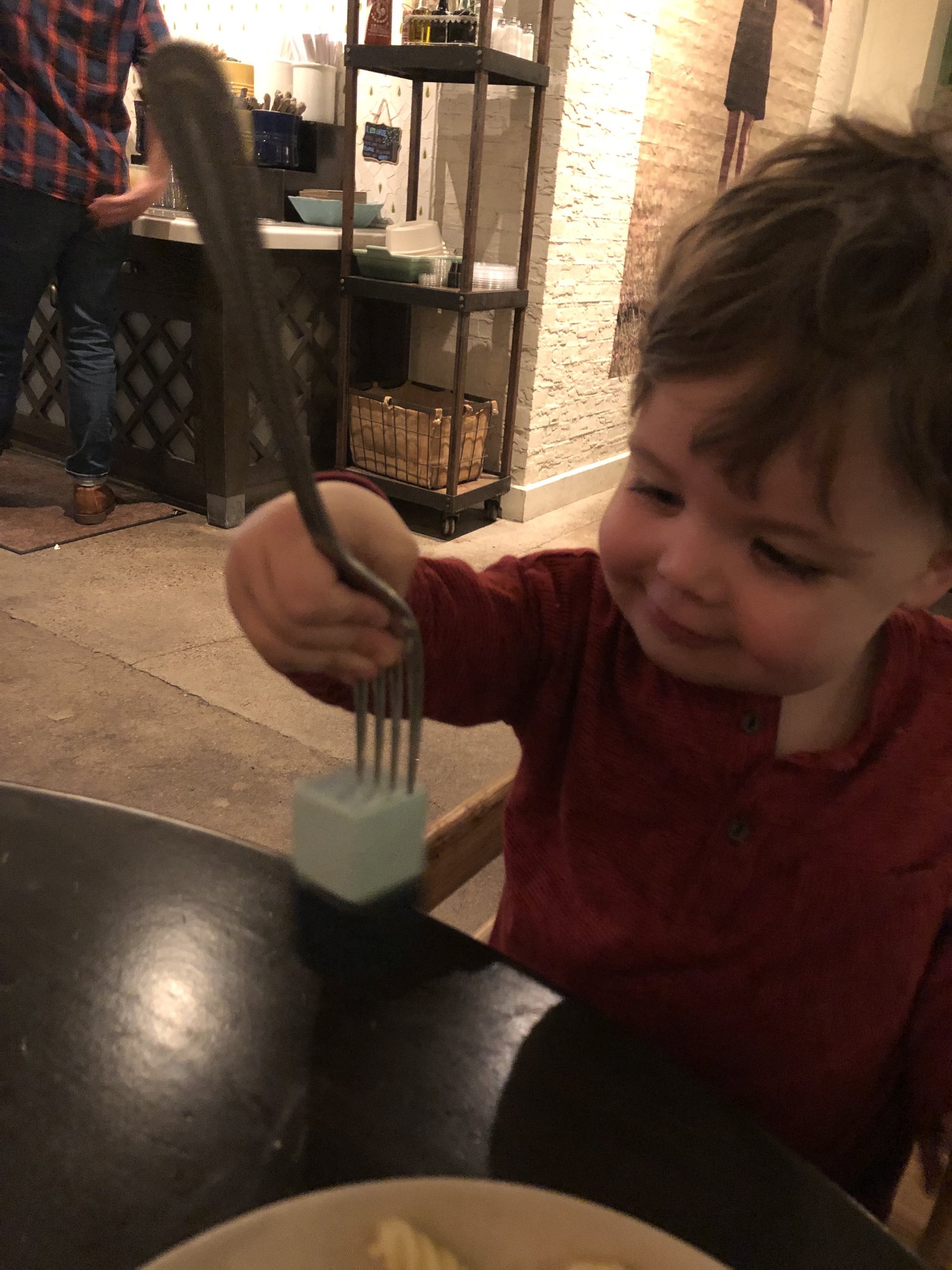 Ben discovers that his spoon is magnetic! Please excuse the guy scratching his butt in the background. LOL.