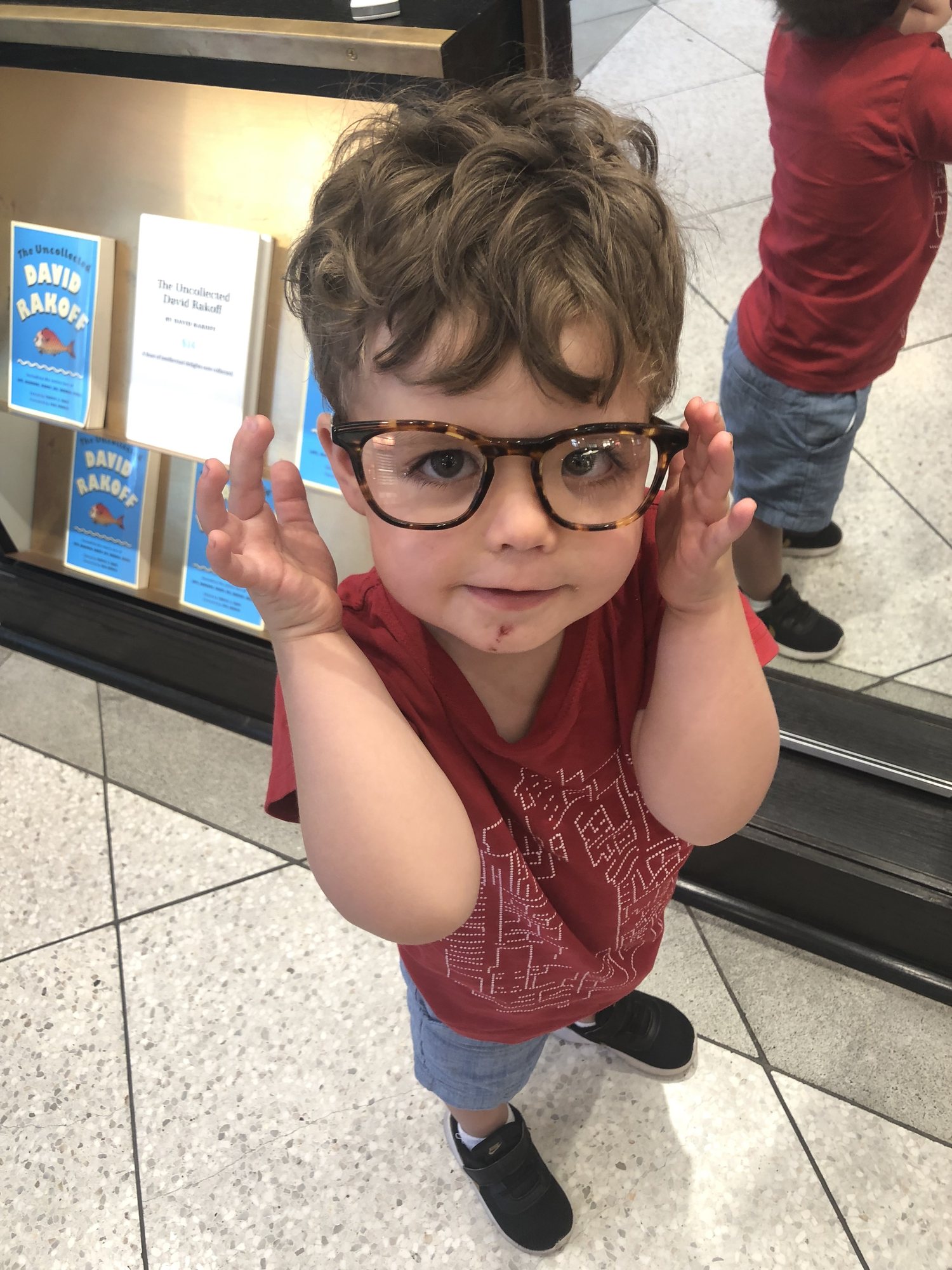 Helping mama pick out glasses.