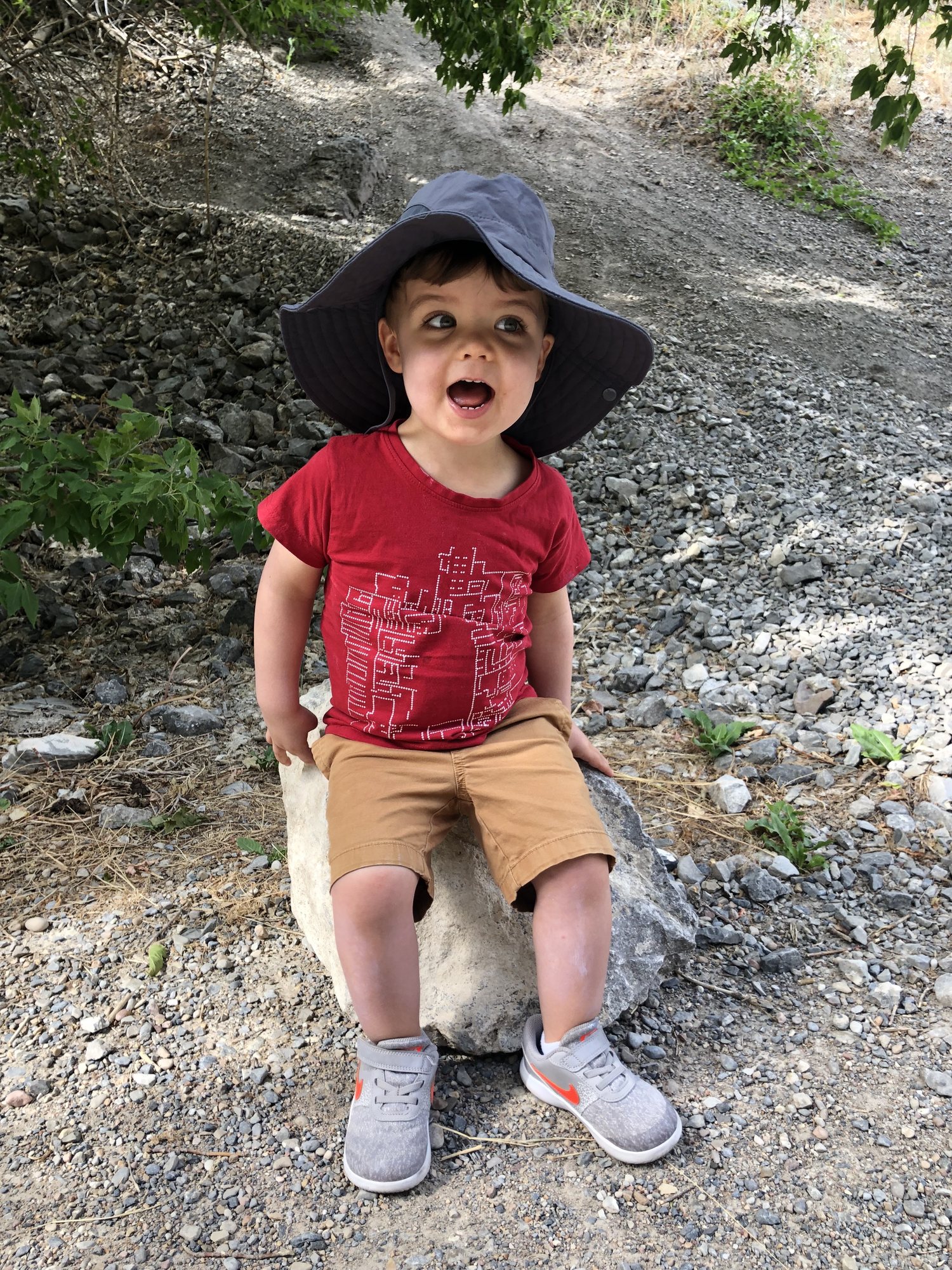 Ben very excited to be sitting on a rock