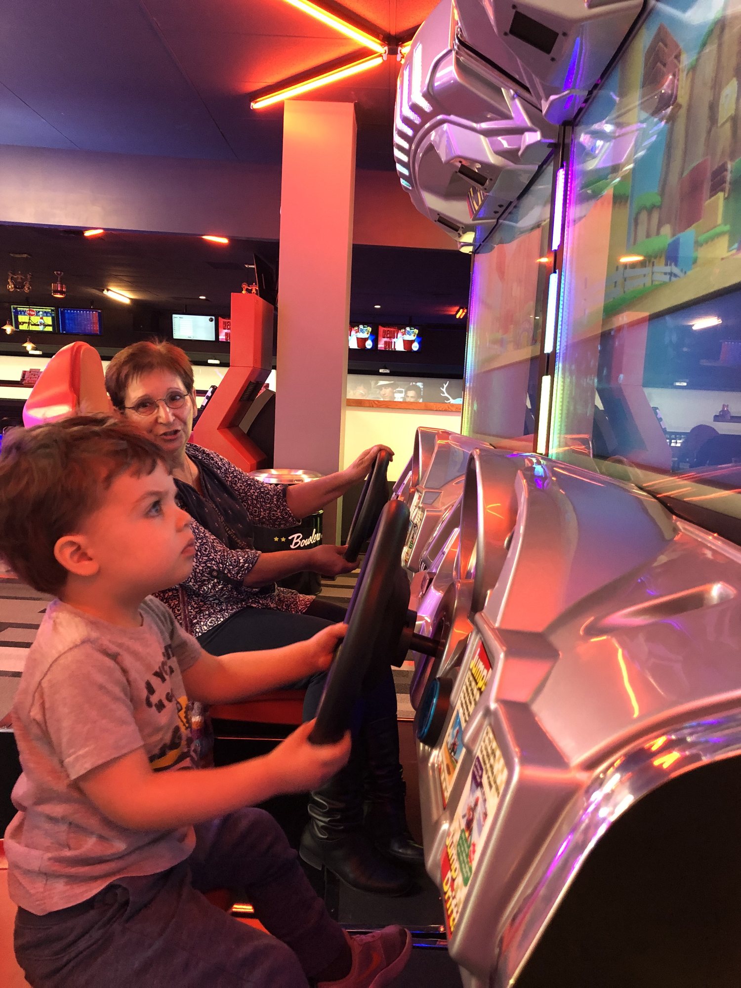 More driving, less talking, Nonna!!! Ben is very serious about his racing games.