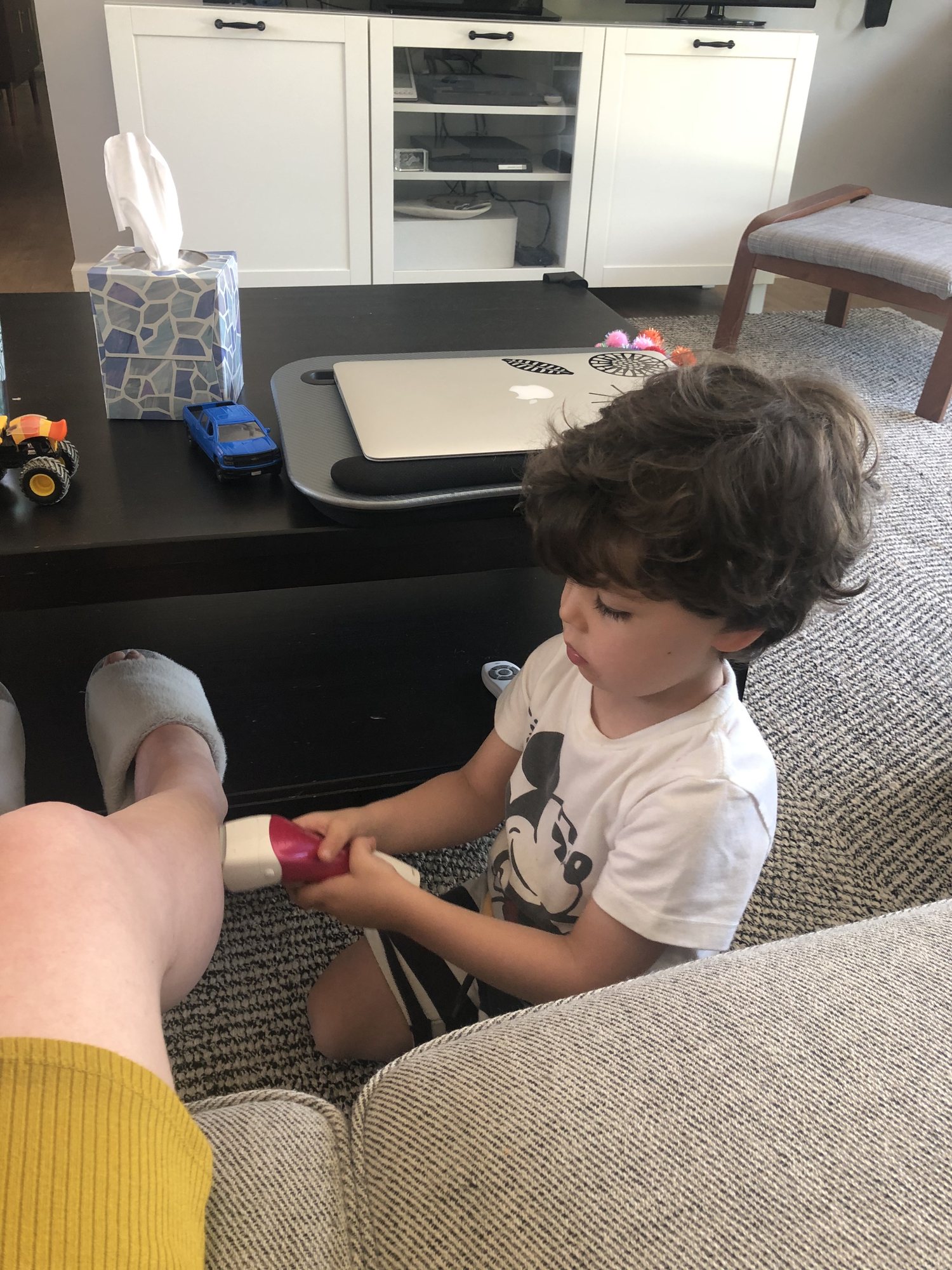 Helping me shave my legs since I can't reach them. This was his idea. LOL.