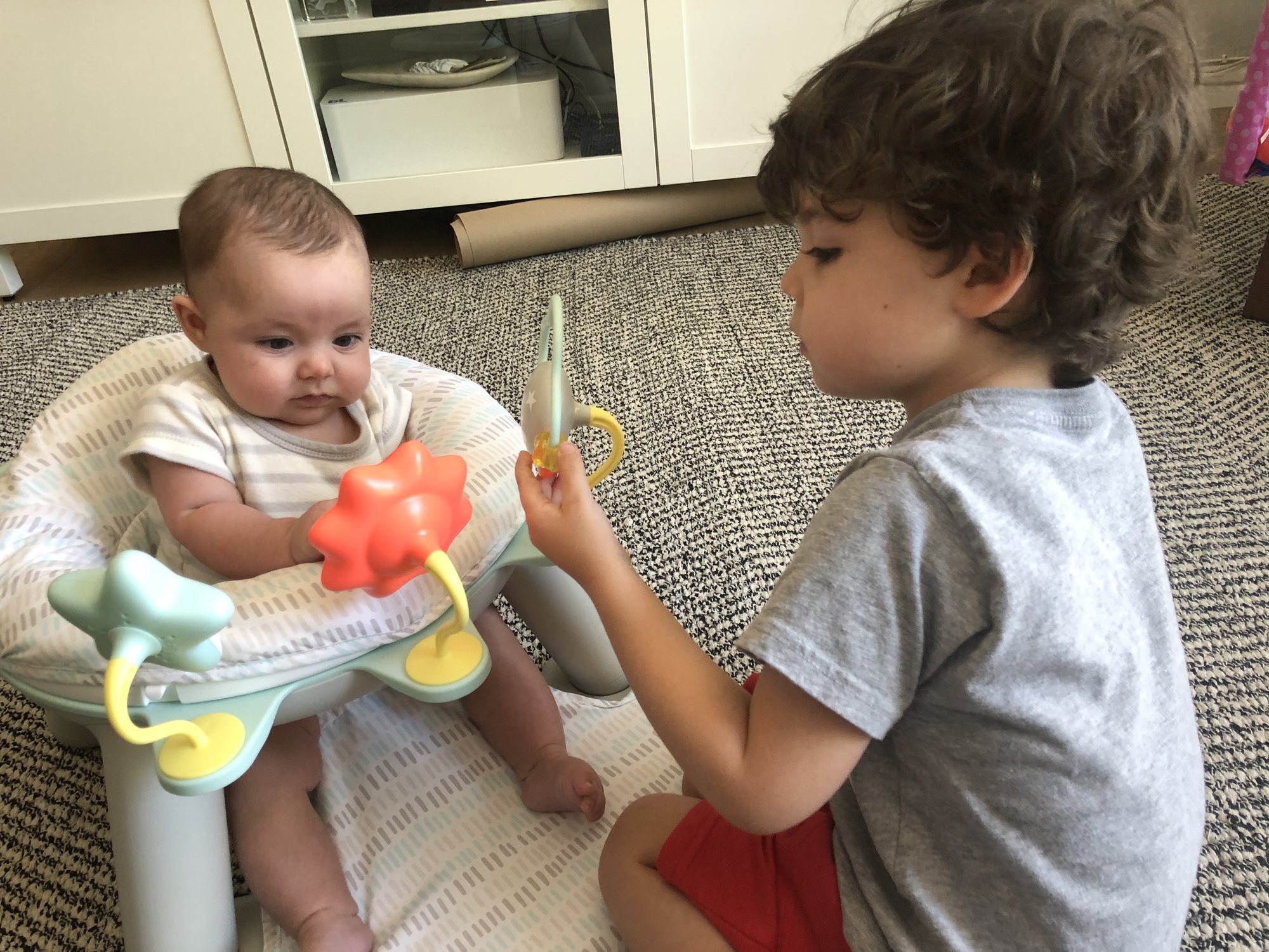 Ben showing Nori how her new chair works. I think he was more excited about it than she was :)