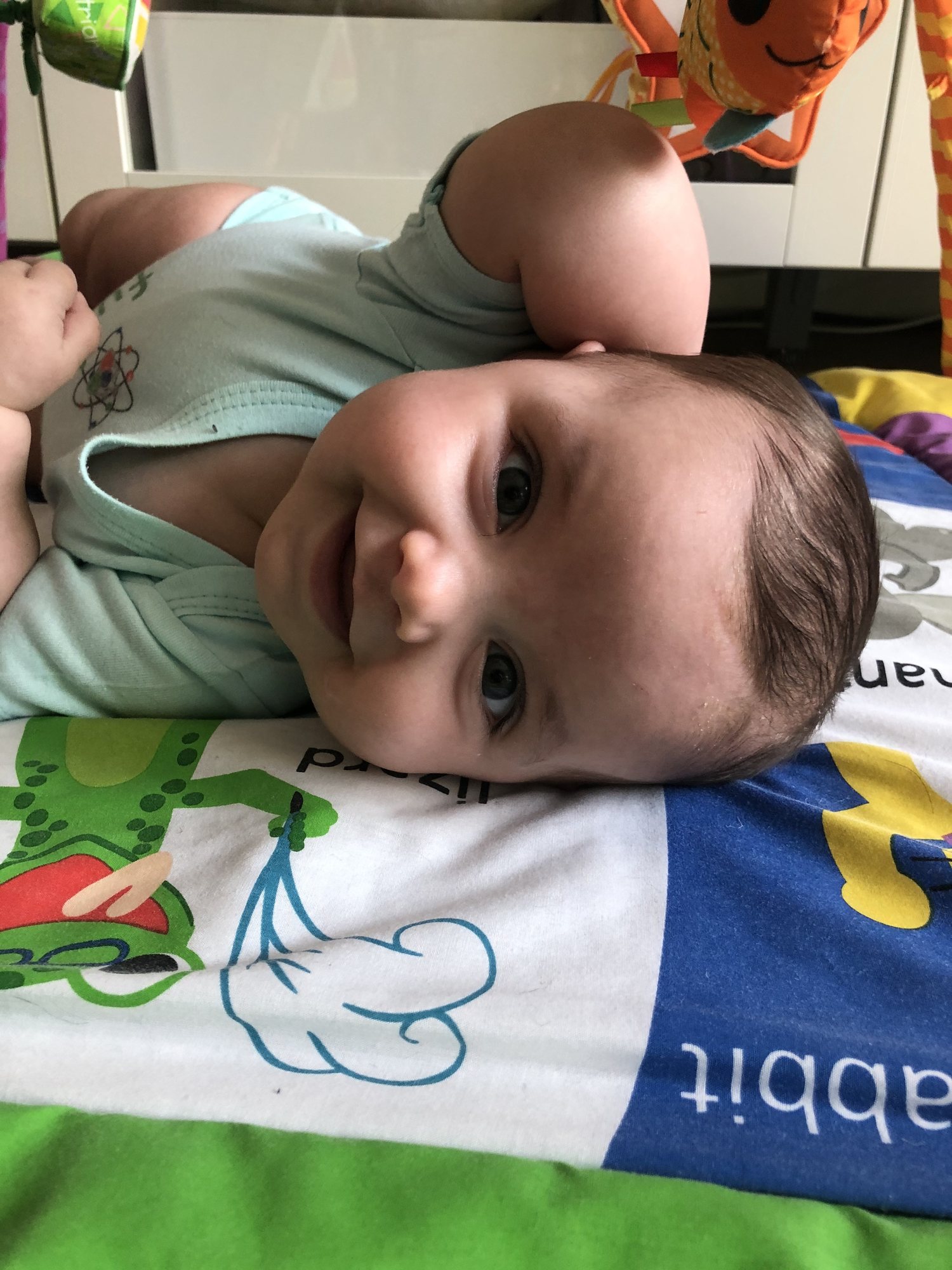 Nora trying to roll over.