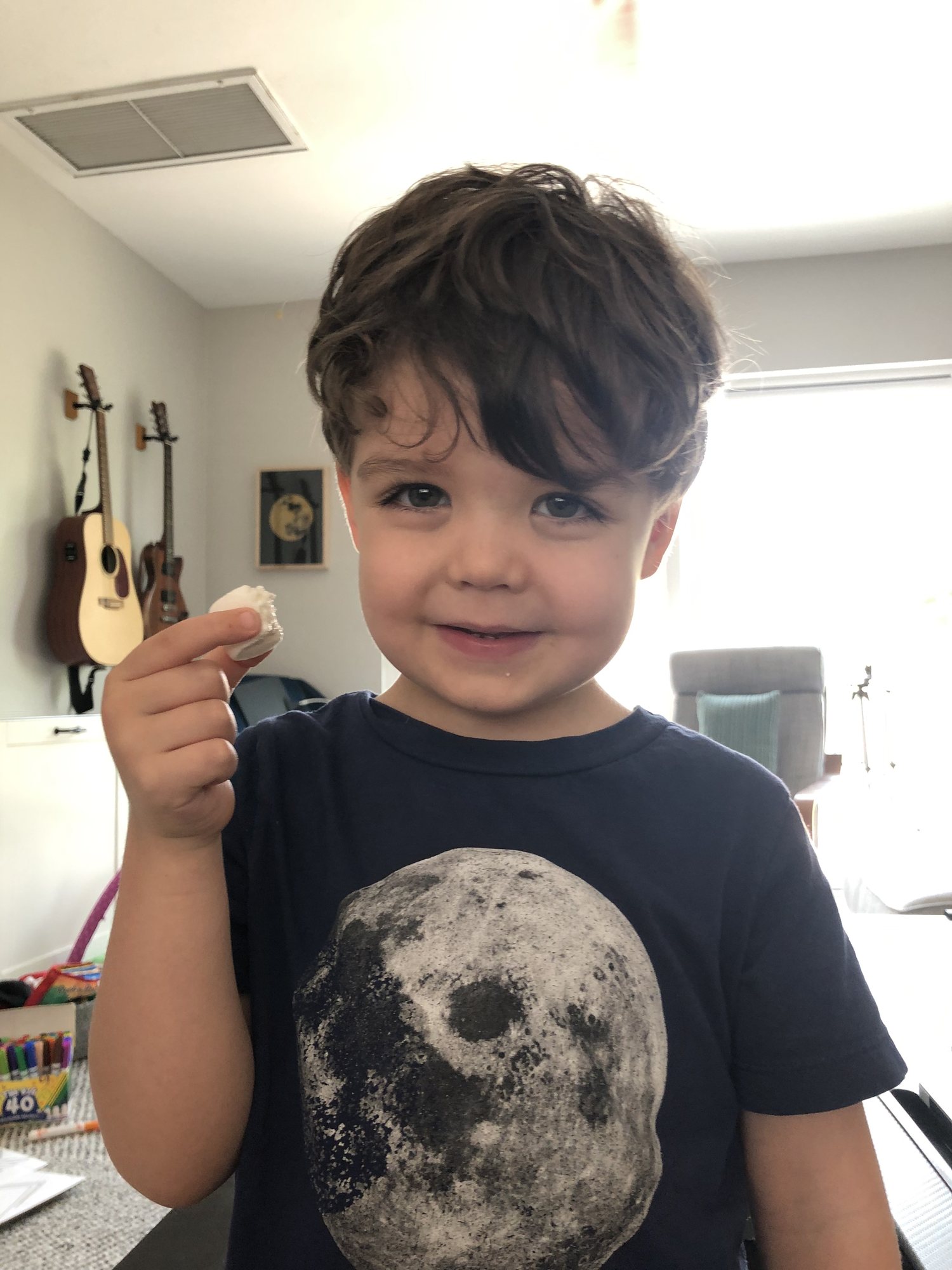 Ben tries his first marshmallow. He only ate half of it and then played with it for 30 min. I guess he's not a fan (?).