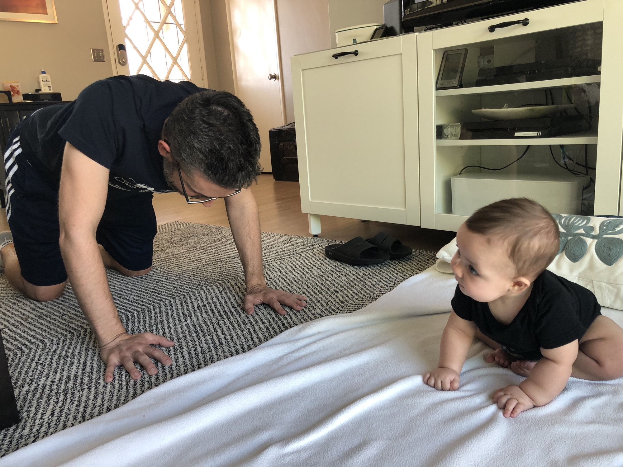 Nora does exercises with dad.