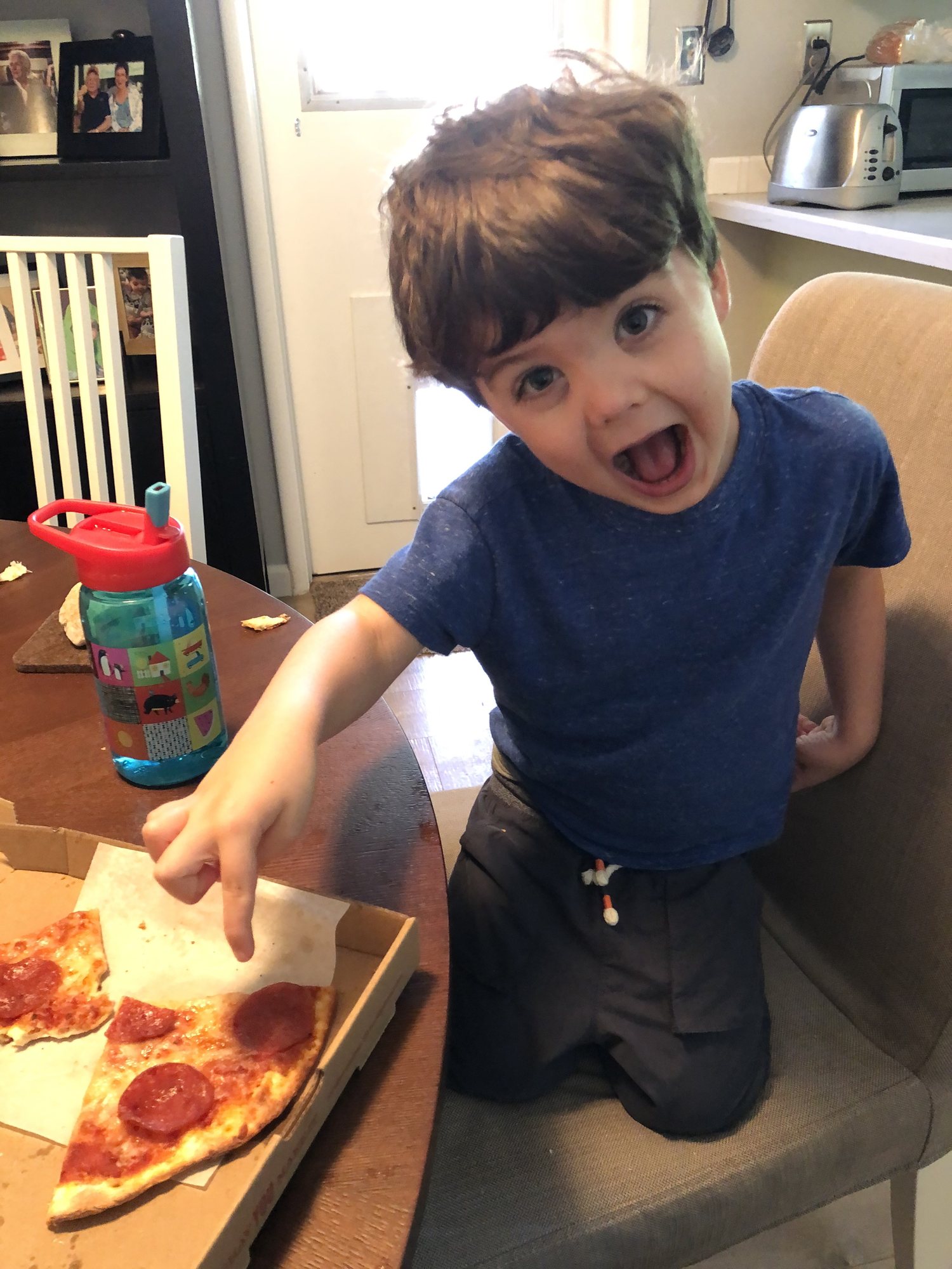 Proud of himself for eating pizza (he's never really like it before)