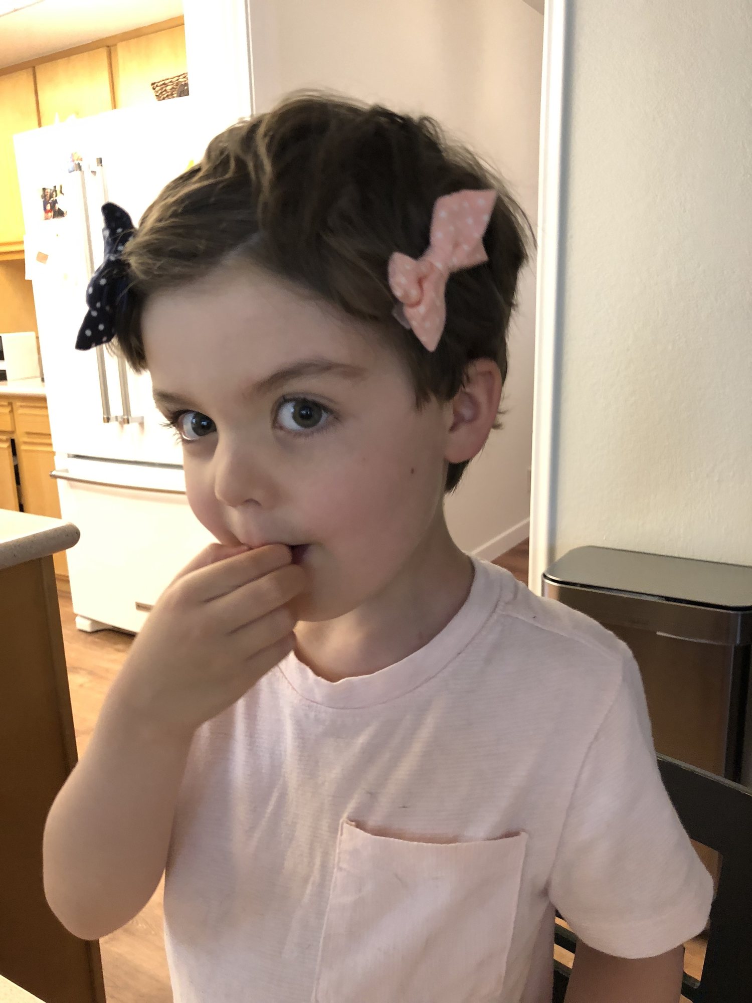 Ben likes Nora's hair bows more than she does! He can definitely pull them off :)