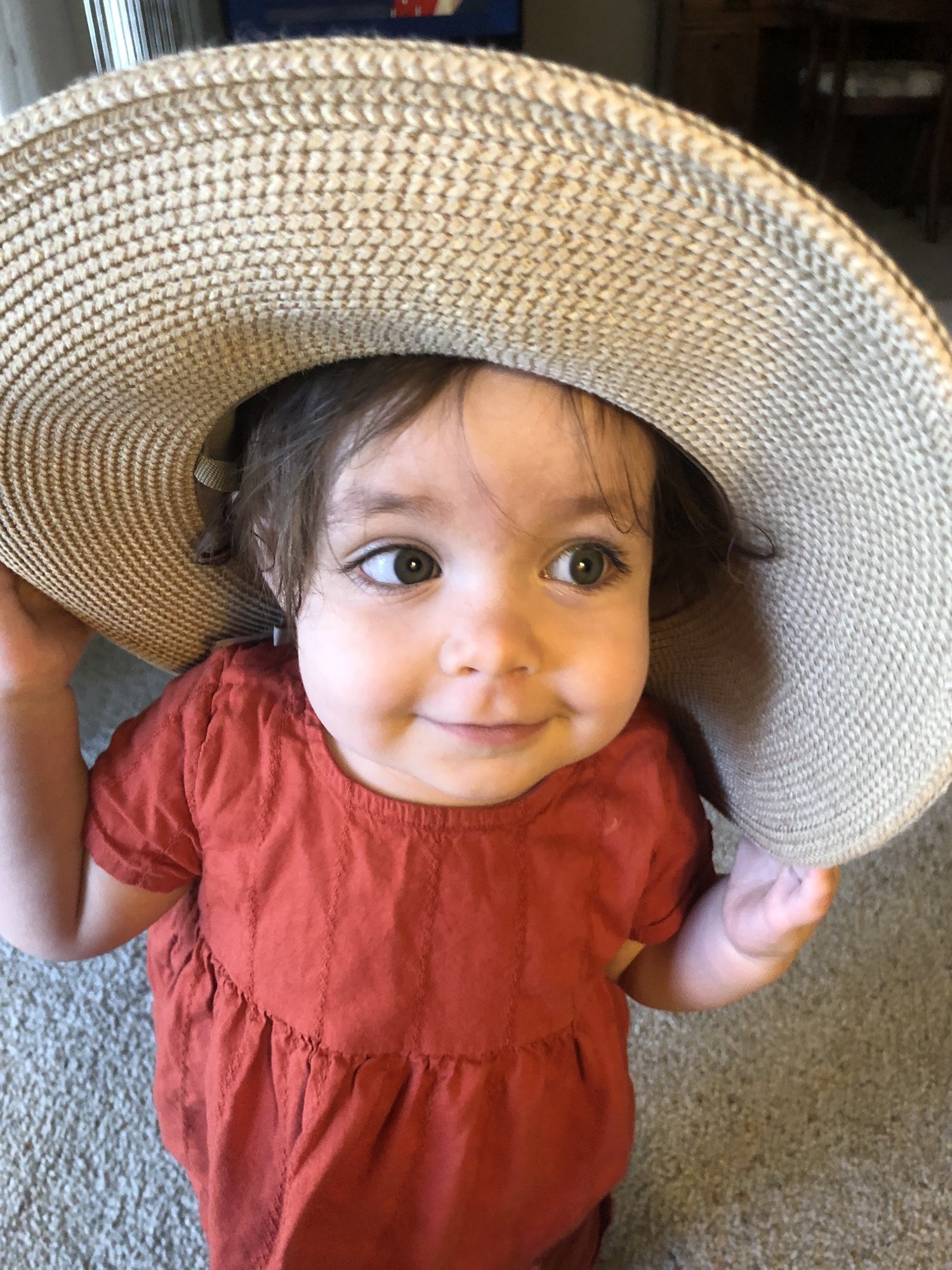 Trying on Mema's hat.