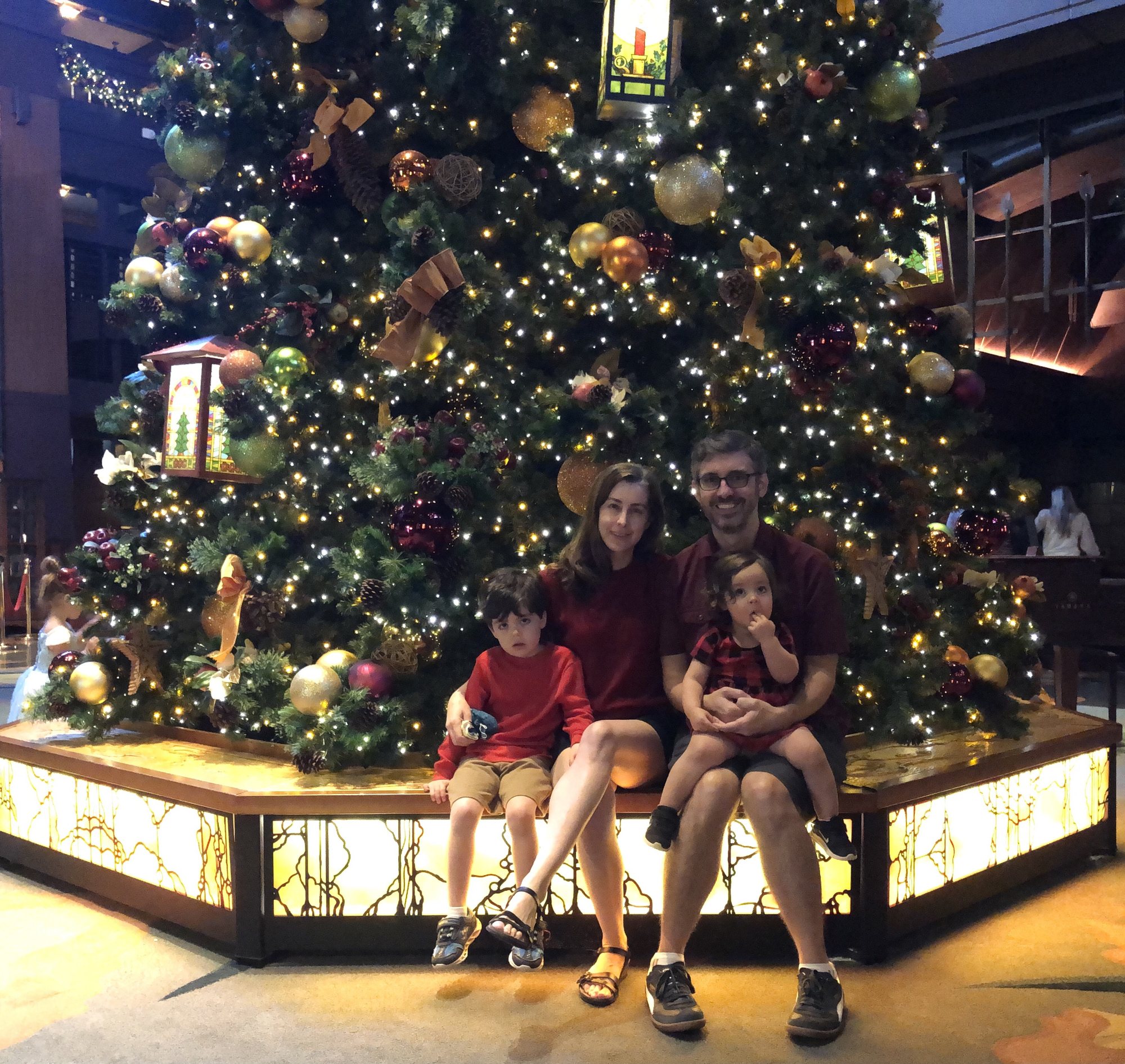 Another failed attempt at a nice picture by the tree in the hotel lobby. Ben was a grumps - poor kid!