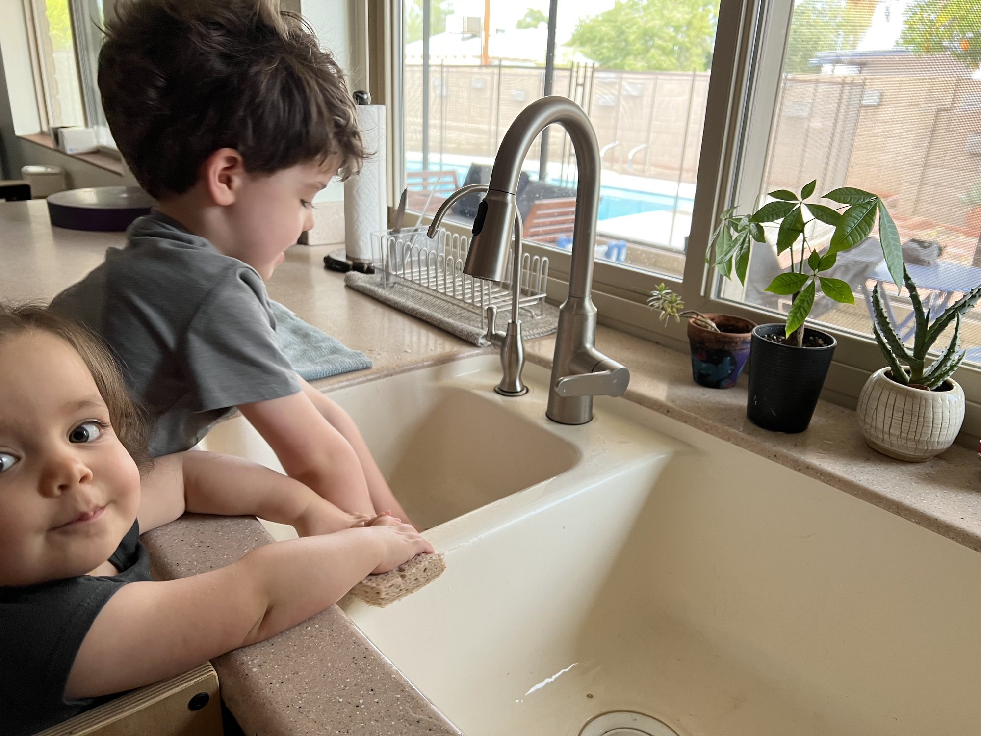 They entertained themselves for a good 20 minutes by "cleaning" the sink!