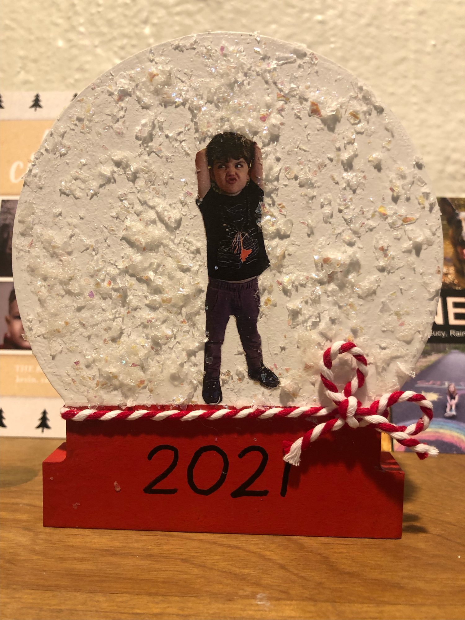 Classic Ben pose on a holiday decoration he made at school. 