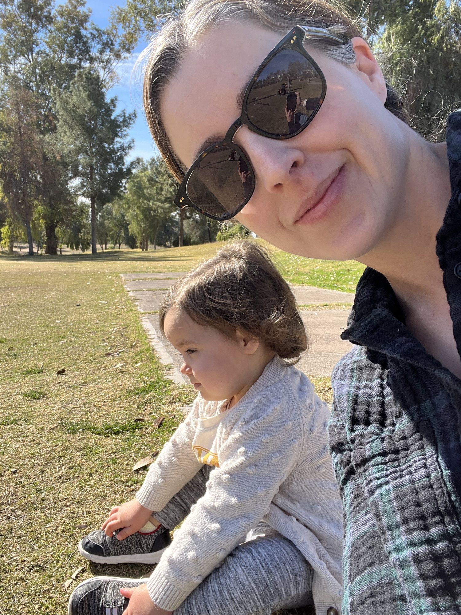 Watching Ben and dad golf.