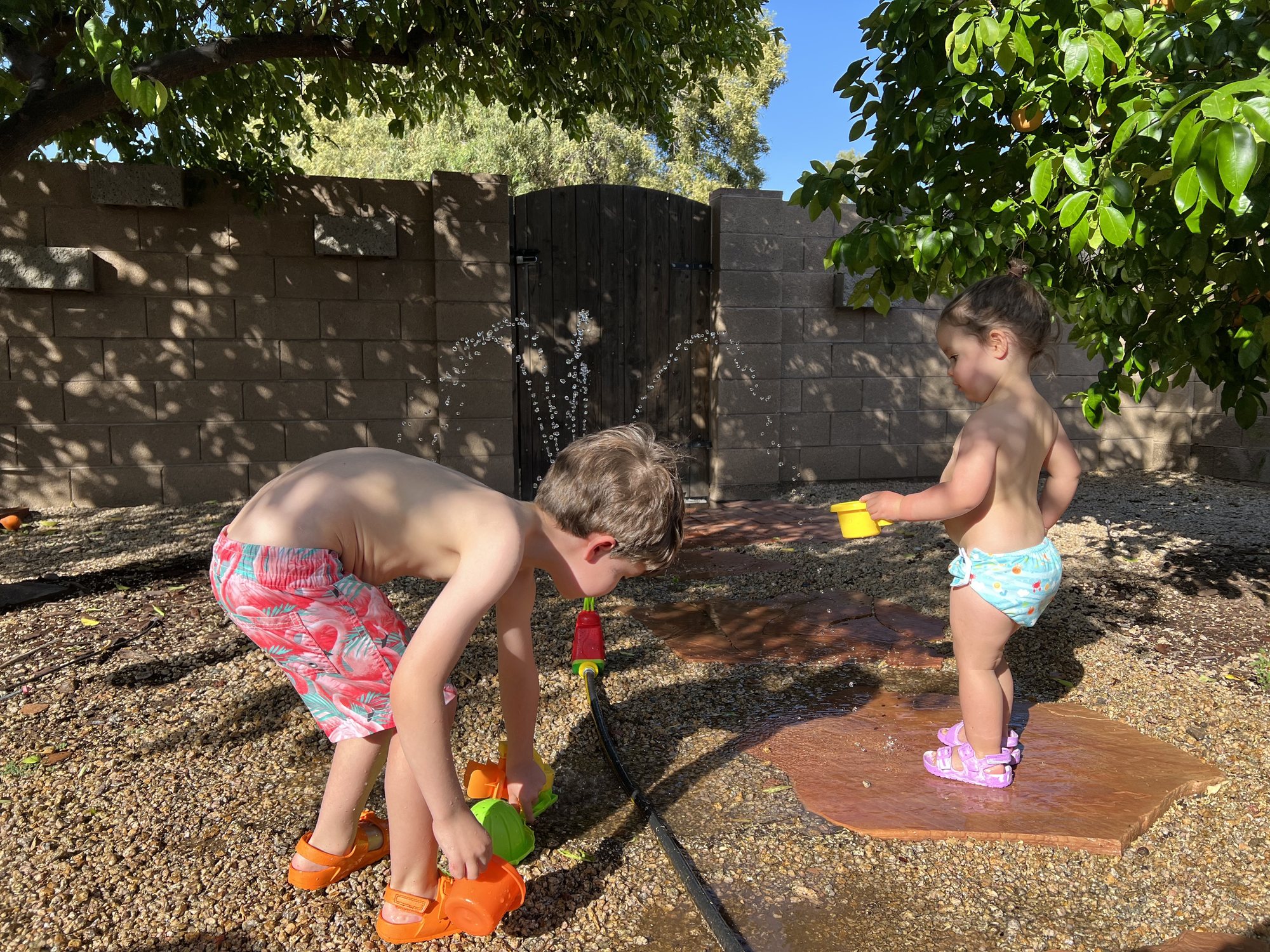 Nora gets in on the sprinkler action