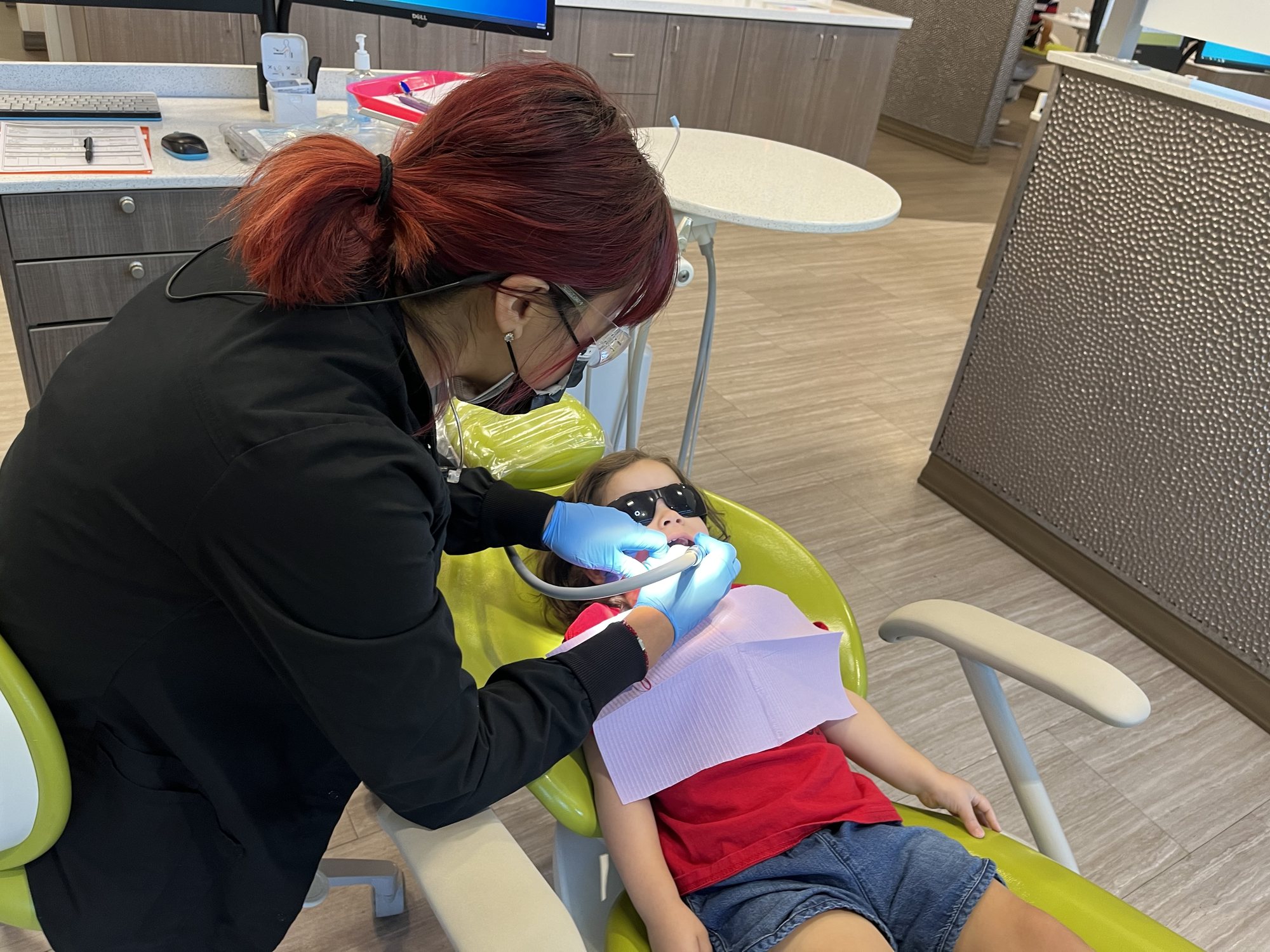 A total champ at the dentist. Apparently most two year olds won't sit like this? The dentist told her that she should stop sucking her thumb. Nora respectfully disagrees. 