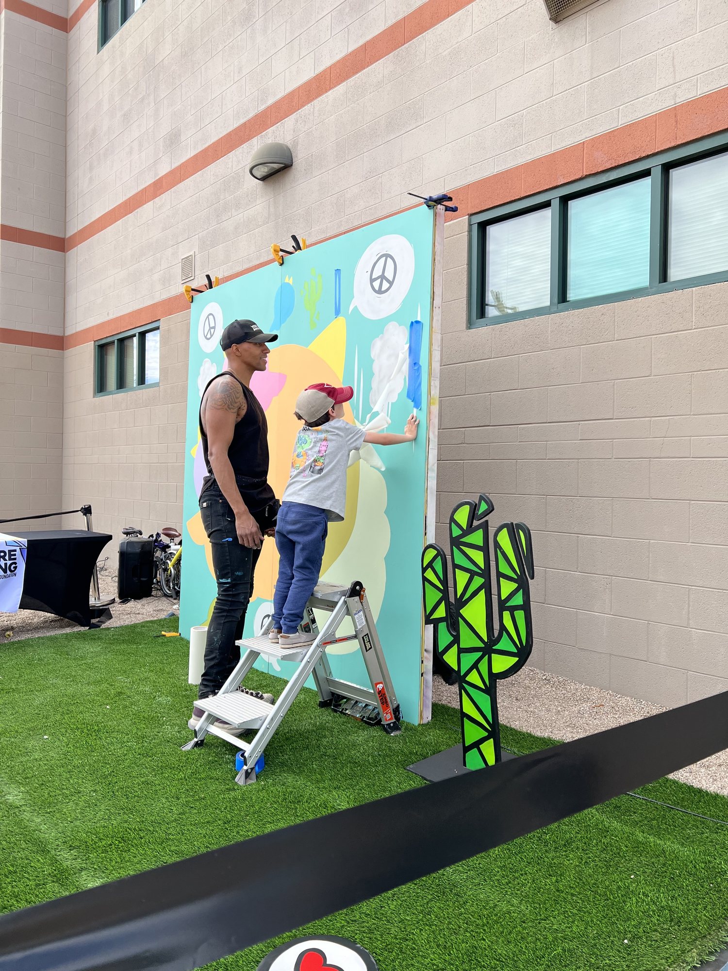 Ben assisting with an art installation at this school :)