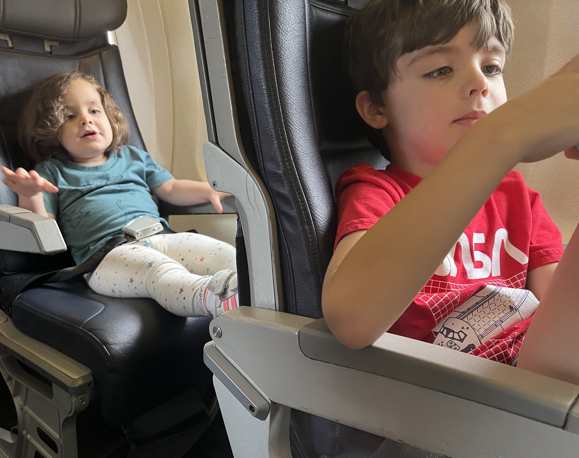Flying to Roanoke! They were soooooo happy that they had their own seats :)