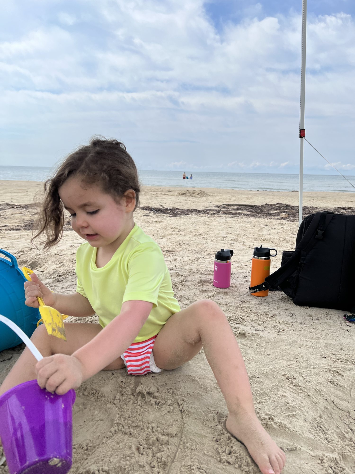 Now she's digging! Ben, Craig and Nonna are in the water in the background :)