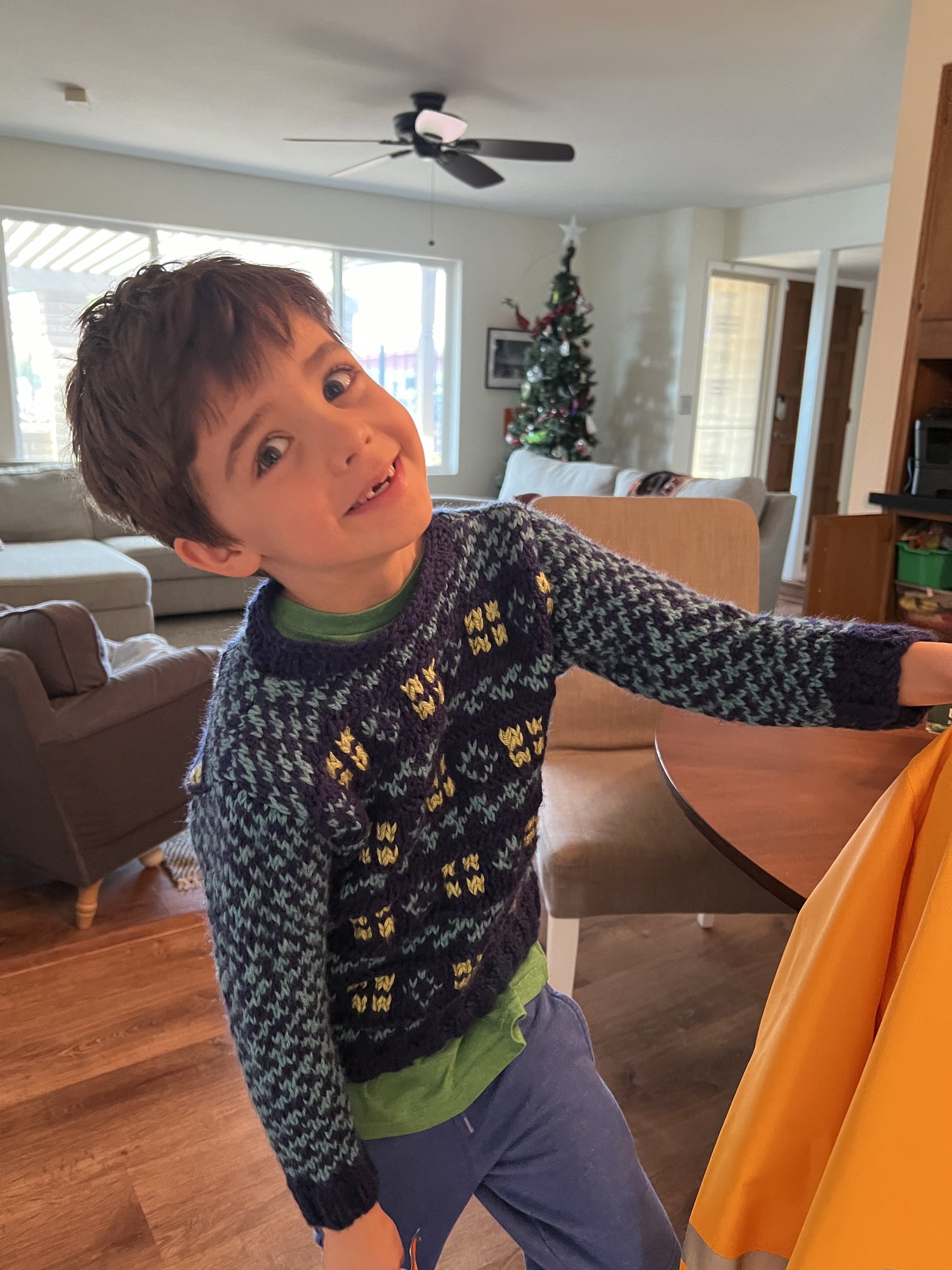 Trying on the sweater that Grandma TT made!