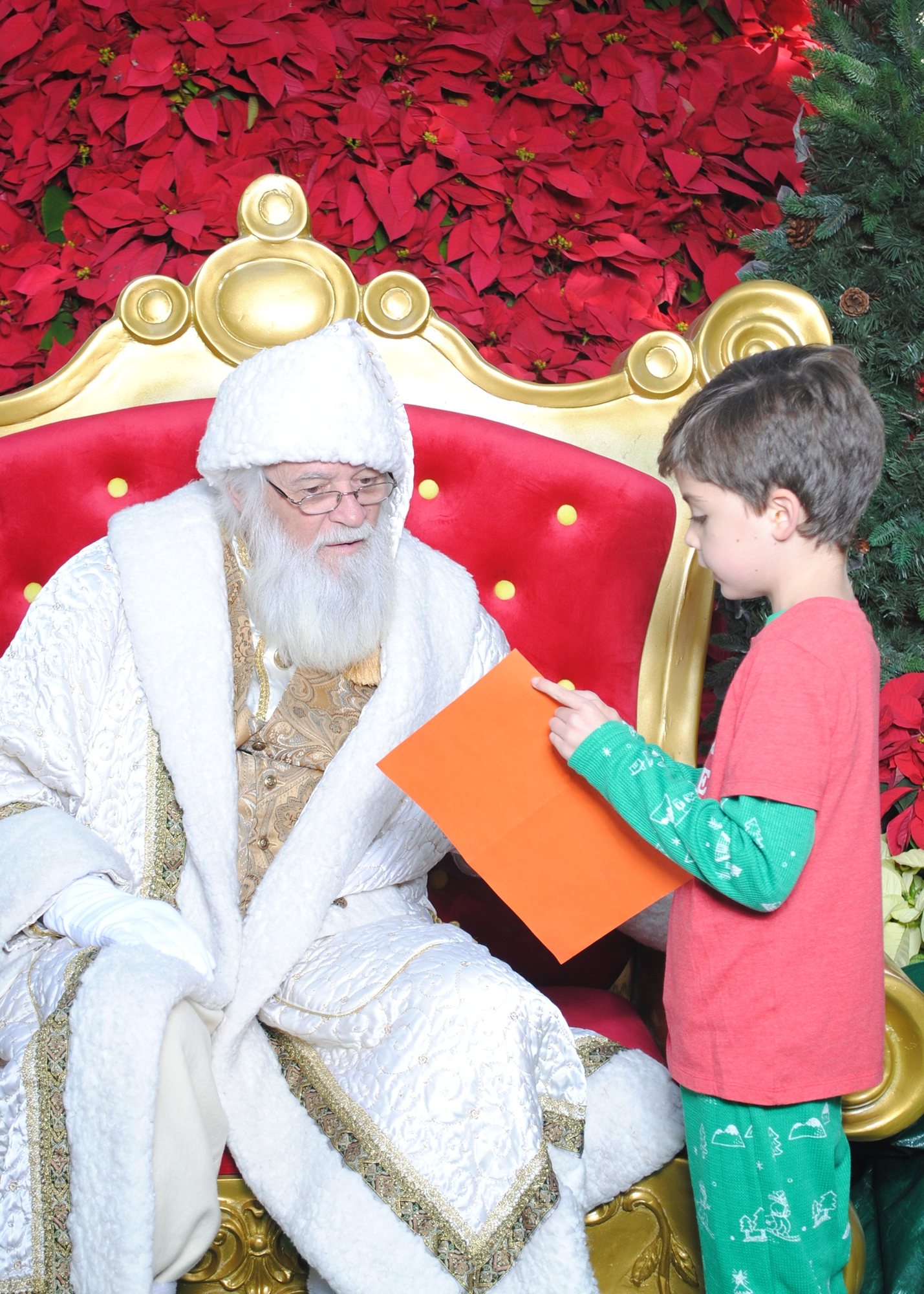 Showing Santa his Christmas list.