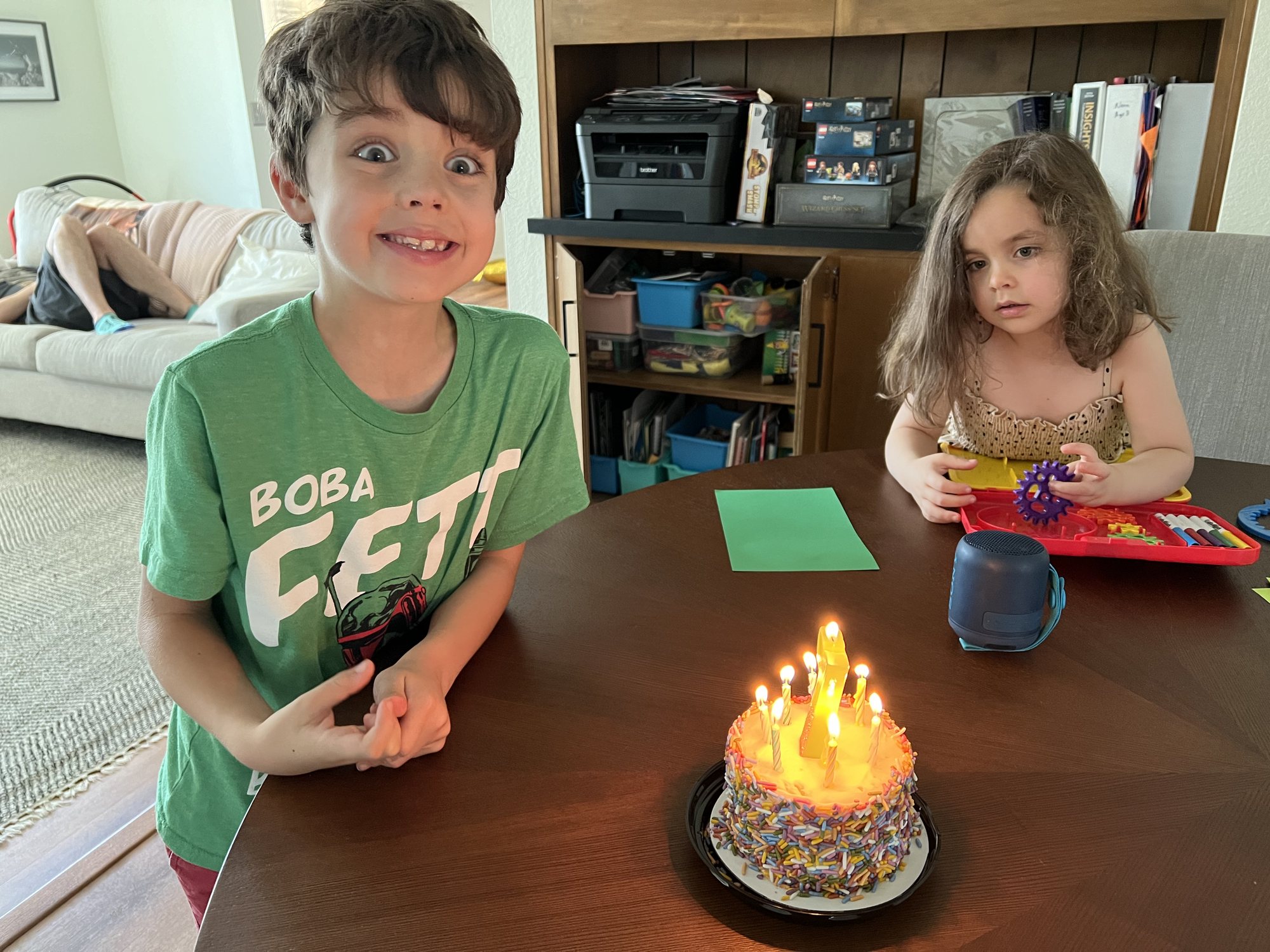 Birthday cake on his actual birthday. He seems surprised to be turning 7. LOL